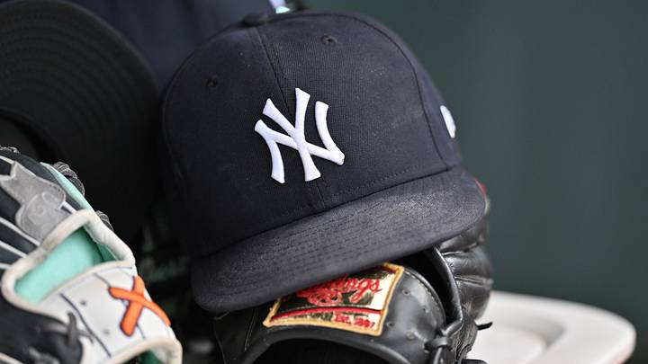 Aug 2, 2026; Chicago, Illinois, USA; A detail view of a New York Yankees baseball hat and a glove during the eighth inning against the Chicago Cubs at Wrigley Field. Mandatory Credit: Patrick Gorski-Imagn Images
