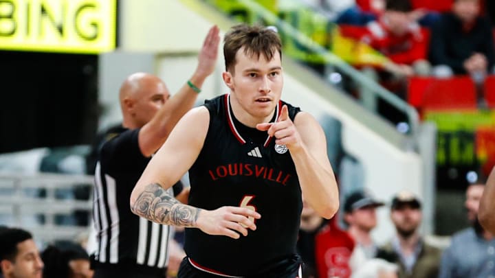 Feb 12, 2025; Raleigh, North Carolina, USA; Louisville Cardinals guard Reyne Smith (6) reacts during the first half of the game against the North Carolina State Wolfpack at Lenovo Center.