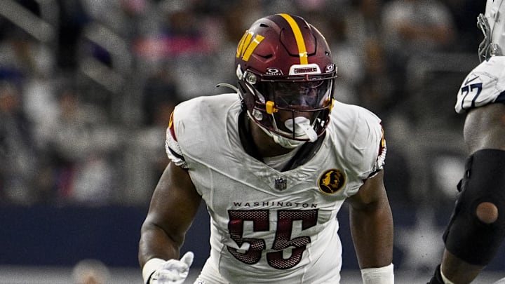 Nov 23, 2023; Arlington, Texas, USA; Washington Commanders defensive end KJ Henry (55) in action during the game between the Dallas Cowboys and the Washington Commanders at AT&T Stadium. Mandatory Credit: Jerome Miron-Imagn Images