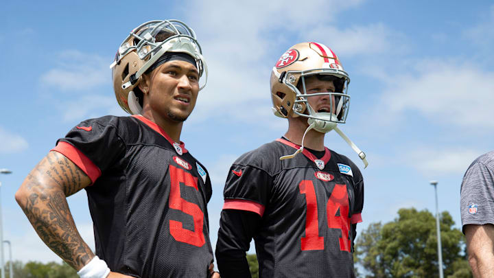 San Francisco 49ers quarterbacks Trey Lance (L) and Sam Darnold (R)