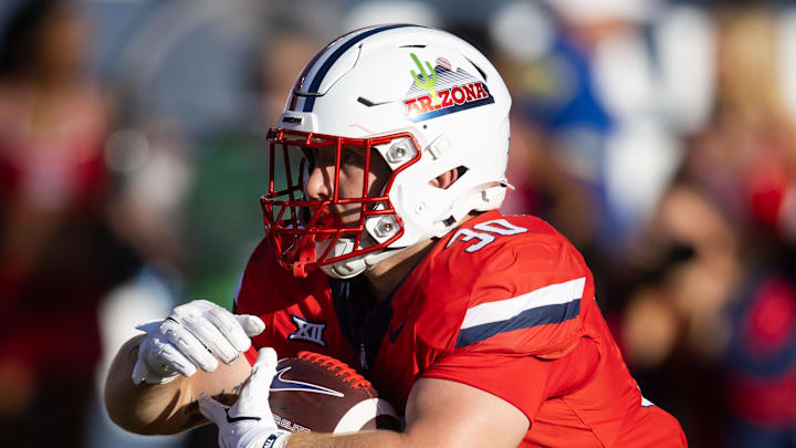 Oct 19, 2024; Tucson, Arizona, USA; Arizona Wildcats running back Kayden Luke (30) against the Colorado Buffalos at Arizona Stadium. Mandatory Credit: Mark J. Rebilas-Imagn Images
