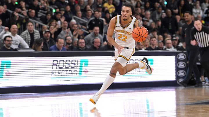 Mar 9, 2024; Providence, Rhode Island, USA; Providence Friars guard Devin Carter (22) drives to the basket against the Connecticut Huskies during the first half at Amica Mutual Pavilion. Mandatory Credit: Eric Canha-USA TODAY Sports