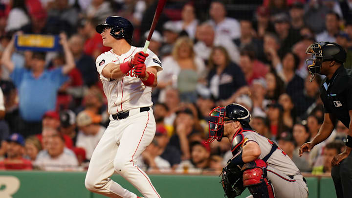 Jun 4, 2024; Boston, Massachusetts, USA; Boston Red Sox right fielder Bobby Dalbec (29) gets a base hit to drive in two runs against the Atlanta Braves in the fourth inning at Fenway Park.