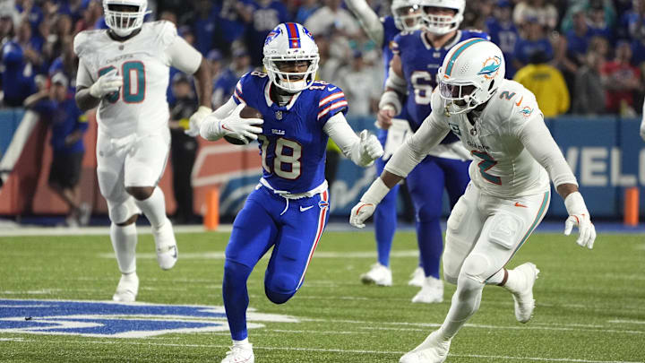 Buffalo Bills wide receiver Elijah Moore (18) runs against Miami Dolphins outside linebacker Bradley Chubb (2) in the fourth quarter at Highmark Stadium.