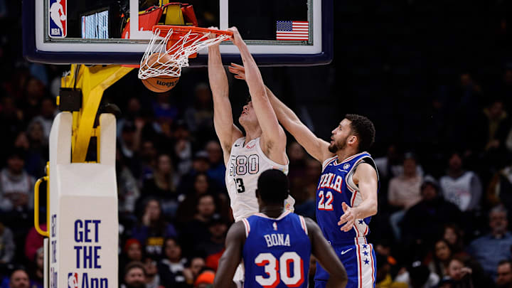 Jan 21, 2025; Denver, Colorado, USA; Denver Nuggets center PJ Hall (13) dunks the ball against Philadelphia 76ers forward Pete Nance (22) as center Adem Bona (30) defends in the fourth quarter at Ball Arena. Mandatory Credit: Isaiah J. Downing-Imagn Images Jan 21, 2025; Denver, Colorado, USA; Denver Nuggets center PJ Hall (13) dunks the ball against Philadelphia 76ers forward Pete Nance (22) as center Adem Bona (30) defends in the fourth quarter at Ball Arena. Mandatory Credit: Isaiah J. Downing-Imagn Images
