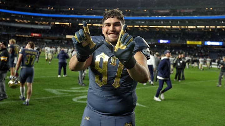 Nov 23, 2024; New York, New York, USA; Notre Dame Fighting Irish defensive lineman Gabriel Rubio (97) celebrates after a win against the Army Black Knights at Yankee Stadium. Mandatory Credit: Danny Wild-Imagn Images Nov 23, 2024; New York, New York, USA; Notre Dame Fighting Irish defensive lineman Gabriel Rubio (97) celebrates after a win against the Army Black Knights at Yankee Stadium. Mandatory Credit: Danny Wild-Imagn Images