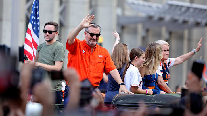 Nov 7, 2022; Houston, Texas, USA; State senator Ted Cruz (orange) waves to the crowd during the Houston Astros Championship Parade in Houston, TX. Mandatory Credit: Erik Williams-Imagn Images