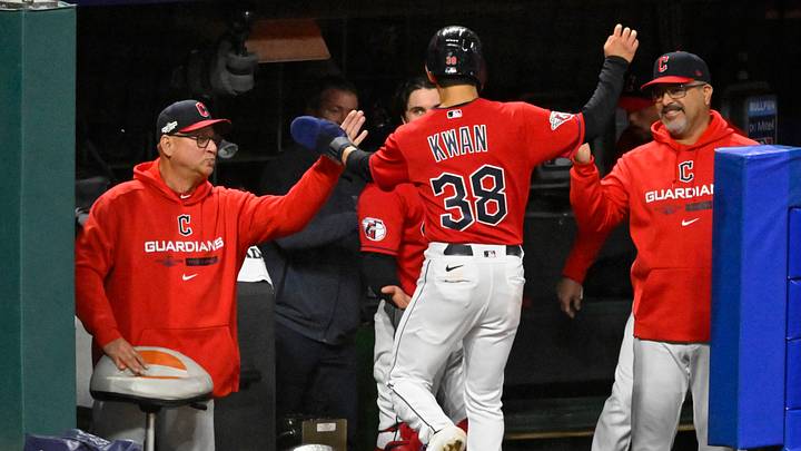 Oct 15, 2022: Cleveland Guardians manager Terry Francona (77) reacts with Cleveland Guardians left fielder Steven Kwan (38) after scoring a run against the New York Yankees during game three of the NLDS for the 2022 MLB Playoffs at Progressive Field. Credit: David Richard-USA TODAY Sports