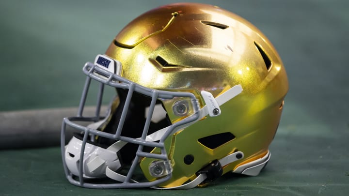 Jan 1, 2022; Glendale, Arizona, USA; Detailed view of a gold Notre Dame Fighting Irish helmet during the 2022 Fiesta Bowl at State Farm Stadium. Jan 1, 2022; Glendale, Arizona, USA; Detailed view of a gold Notre Dame Fighting Irish helmet during the 2022 Fiesta Bowl at State Farm Stadium.