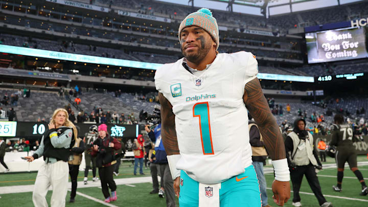 Miami Dolphins quarterback Tua Tagovailoa walks on the field after the game against the New York Jets at MetLife Stadium in December 2025.