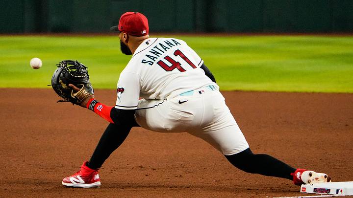 Apr 2, 2026; Phoenix, Arizona, USA; Arizona Diamondbacks first baseman Carlos Santana (41) makes a play at first during the fourth inning at Chase Field. Mandatory Credit: Arianna Grainey-Imagn Images