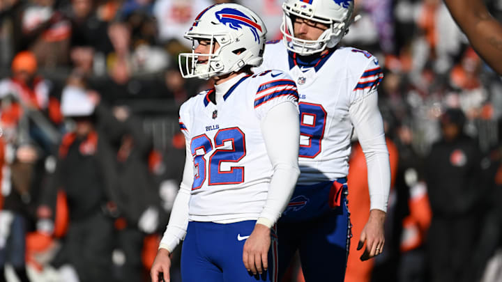 Dec 21, 2025; Cleveland, Ohio, USA;  Buffalo Bills kicker Michael Badgley (32) watches his missed extra point with holder Mitch Wishnowsky (19) during the first half against the Cleveland Browns at Huntington Bank Field.
