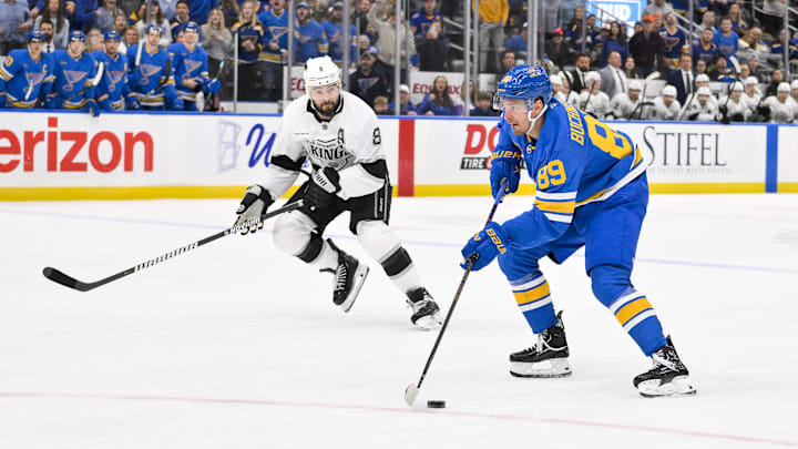 Oct 21, 2025; St. Louis, Missouri, USA; St. Louis Blues left wing Pavel Buchnevich (89) controls the puck as Los Angeles Kings defenseman Drew Doughty (8) defends during overtime at Enterprise Center. Mandatory Credit: Jeff Curry-Imagn Images