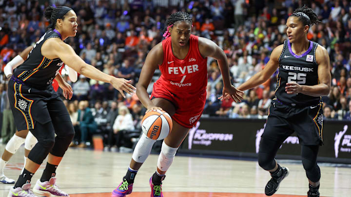 Sep 25, 2024; Uncasville, Connecticut, USA; Indiana Fever forward Aliyah Boston (7) dribbles the ball during the first half against the Connecticut Sun during game two of the first round of the 2024 WNBA Playoffs at Mohegan Sun Arena. Mandatory Credit: Paul Rutherford-Imagn Images