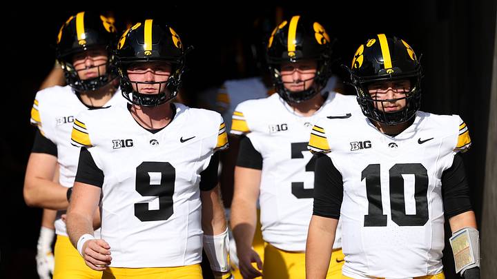 Oct 24, 2026; Minneapolis, Minnesota, USA; Iowa Hawkeyes quarterback Jeremy Hecklinski (10) and Iowa Hawkeyes quarterback Hank Brown (9) take the field before the game against the Minnesota Golden Gophers at Huntington Bank Stadium. Mandatory Credit: Matt Krohn-Imagn Images