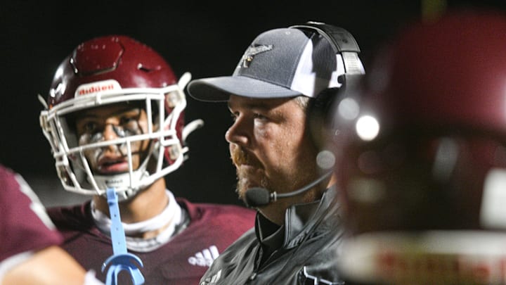 Niceville High School Football Coach Grant Thompson talks with his team during Friday's Kickoff Classic against Lincoln High School at Niceville.