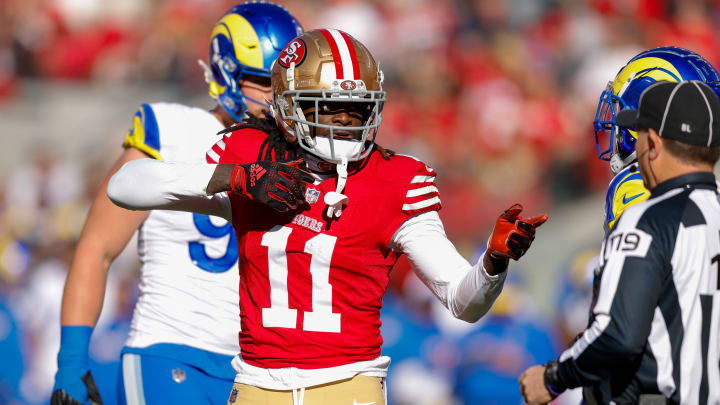 Jan 7, 2024; Santa Clara, California, USA; San Francisco 49ers wide receiver Brandon Aiyuk (11) celebrates after a play against the Los Angeles Rams during the first quarter at Levi's Stadium. Mandatory Credit: Sergio Estrada-USA TODAY Sports