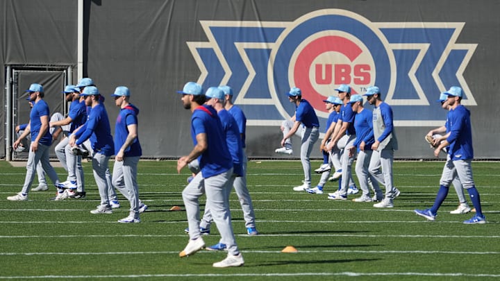 Feb 10, 2025; Mesa, AZ, USA; Chicago Cubs pitchers warm up during spring training camp.