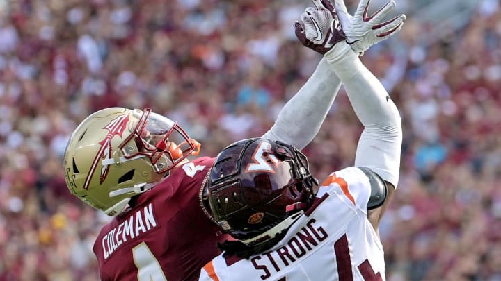 Oct 7, 2023; Tallahassee, Florida, USA; Florida State Seminoles wide receiver Keon Coleman (4) misses a catch as Virginia Tech Hokies cornerback Dorian Strong (44) defends during the first half at Doak S. Campbell Stadium. Mandatory Credit: Melina Myers-USA TODAY Sports