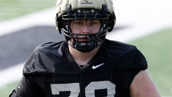 Purdue Boilermakers offensive lineman Joey Tanona (79) lines up for a drill. Purdue Boilermakers offensive lineman Joey Tanona (79) lines up for a drill.