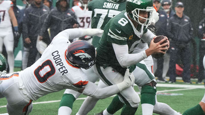 East Rutherford, NJ -- September 29 -- Jonathon Cooper of Denver and Aaron Rodgers of the Jets in the first half as the Denver Broncos edged the New York Jets 10-9 at MetLife Stadium. East Rutherford, NJ -- September 29 -- Jonathon Cooper of Denver and Aaron Rodgers of the Jets in the first half as the Denver Broncos edged the New York Jets 10-9 at MetLife Stadium.