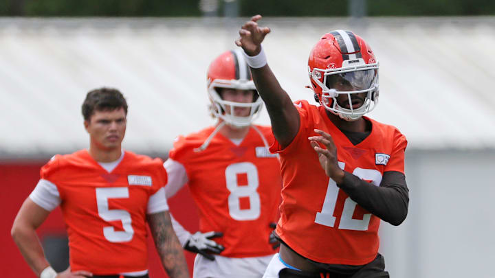 Browns quarterback Shedeur Sanders throws as QBs Dillon Gabriel (5) and Kenny Pickett look on during minicamp, Tuesday, June 10, 2025, in Berea.