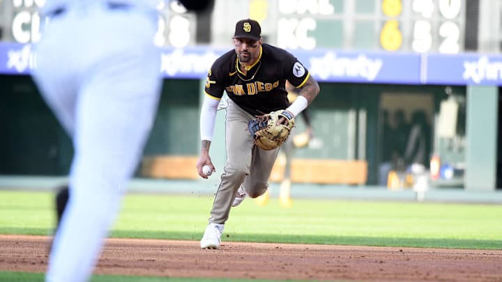 Apr 22, 2026; Denver, Colorado, USA;  San Diego Padres outfielder Nick Castellanos (21) fields a ground ball hit by Colorado Rockies outfielder Mickey Moniak (22) during the first inning at Coors Field. Mandatory Credit: Christopher Hanewinckel-Imagn Images