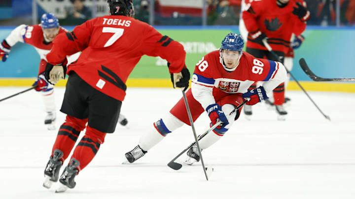 Feb 18, 2026; Milan, Italy; Martin Necas of Czechia controls the puck against Devon Toews of Canada in a men's ice hockey quarterfinal during the Milano Cortina 2026 Olympic Winter Games at Milano Santagiulia Ice Hockey Arena. Mandatory Credit: Geoff Burke-Imagn Images