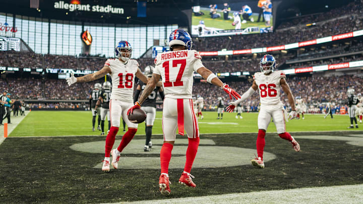  New York Giants wide receivers Isaiah Hodgins (18),  Wan'Dale Robinson (17),  and Darius Slayton (86).