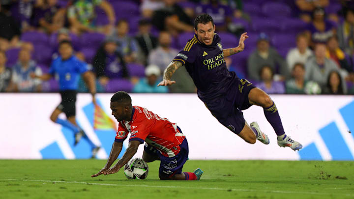 Aug 4, 2024; Orlando, Florida, USA; Atletico de San Luis forward Vitor Samuel Ferreira Arantes (11) is fouled by Orlando City defender Kyle Smith (24) resulting in a red card in the first half during the Leagues Cup group stage at INTER&CO Stadium. Mandatory Credit: Nathan Ray Seebeck-USA TODAY Sports