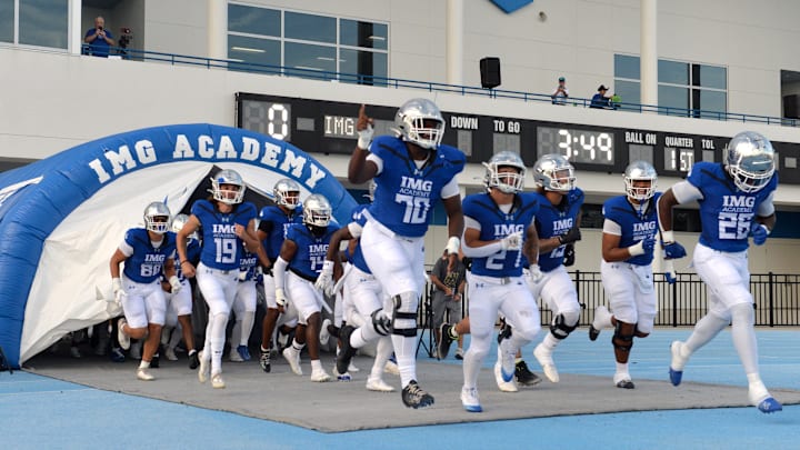 IMG Academy players run onto the field. The IMG Academy National squad hosted the Cocoa High School Tigers Friday, Sept. 6, 2024 in Bradenton.