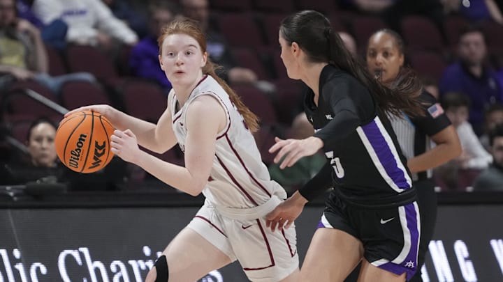 March 11, 2024; Las Vegas, NV, USA; Santa Clara Broncos guard Tess Heal (34) dribbles the basketball against Portland Pilots guard Emme Shearer (5) during the second half in the semifinals of the WCC Basketball Championship at Orleans Arena. Mandatory Credit: Kyle Terada-Imagn Images