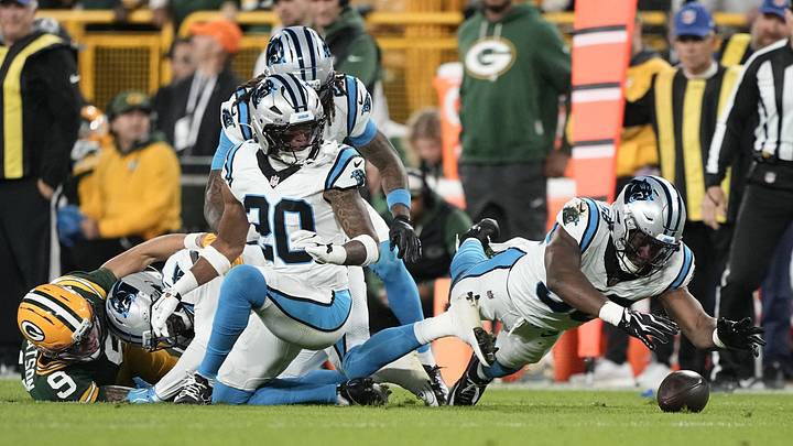 Carolina Panthers linebacker Bobby Okereke (58) recovers a fumble against the Green Bay Packers Carolina Panthers linebacker Bobby Okereke (58) recovers a fumble against the Green Bay Packers