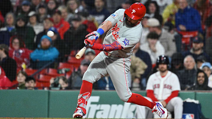 May 14, 2026; Boston, Massachusetts, USA; Philadelphia Phillies designated hitter Kyle Schwarber (12) hits a two run home run  during the eighth inning against the Boston Red Sox at Fenway Park. Mandatory Credit: Eric Canha-Imagn Images