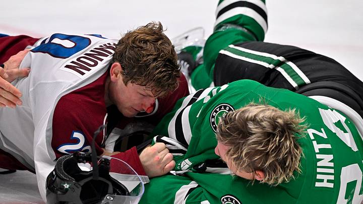 Oct 13, 2026; Dallas, Texas, USA; Colorado Avalanche center Nathan MacKinnon (29) fights with Dallas Stars center Roope Hintz (24) during the second period at the American Airlines Center. Mandatory Credit: Jerome Miron-Imagn Images