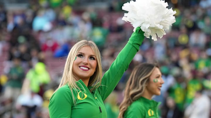 Sep 30, 2023; Stanford, California, USA; An Oregon Ducks cheerleader performs during the third quarter against the Stanford Cardinal at Stanford Stadium. Mandatory Credit: Darren Yamashita-Imagn Images Sep 30, 2023; Stanford, California, USA; An Oregon Ducks cheerleader performs during the third quarter against the Stanford Cardinal at Stanford Stadium. Mandatory Credit: Darren Yamashita-Imagn Images