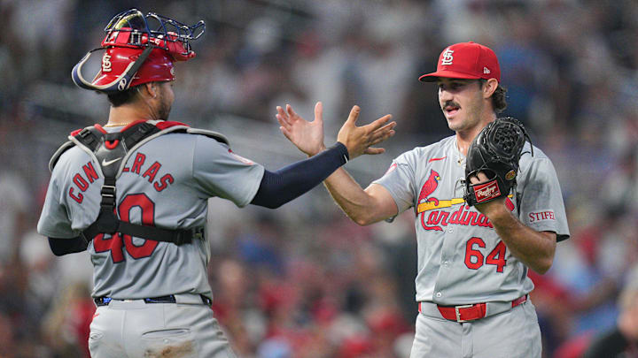 Aug 23, 2024; Minneapolis, Minnesota, USA; St. Louis Cardinals pitcher Ryan Fernandez (64) and catcher Willson Contreras (40) celebrate after the game against the Minnesota Twins at Target Field. Mandatory Credit: Brad Rempel-Imagn Images