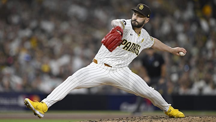 Oct 2, 2024; San Diego, California, USA; San Diego Padres pitcher Tanner Scott (66) throws during the sixth inning of game two in the Wildcard round for the 2024 MLB Playoffs against the Atlanta Braves at Petco Park. Mandatory Credit: Denis Poroy-Imagn Images