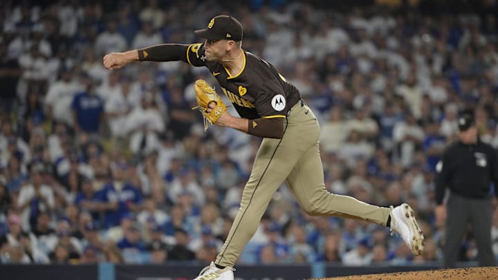 Oct 11, 2024; Los Angeles, California, USA; San Diego Padres pitcher Jason Adam (40) pitches in the eighth inning against the Los Angeles Dodgers during game five of the NLDS for the 2024 MLB Playoffs at Dodger Stadium. 