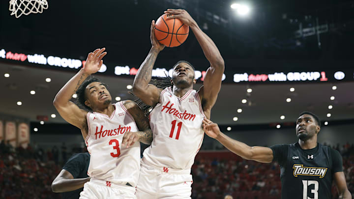 Nov 8, 2025; Houston, Texas, USA; Houston Cougars forward Joseph Tugler (11) and guard Ramon Walker Jr. (3) attempt to get a rebound away from Towson Tigers forward Chike Ndefo (13) during the first half at Fertitta Center. 
