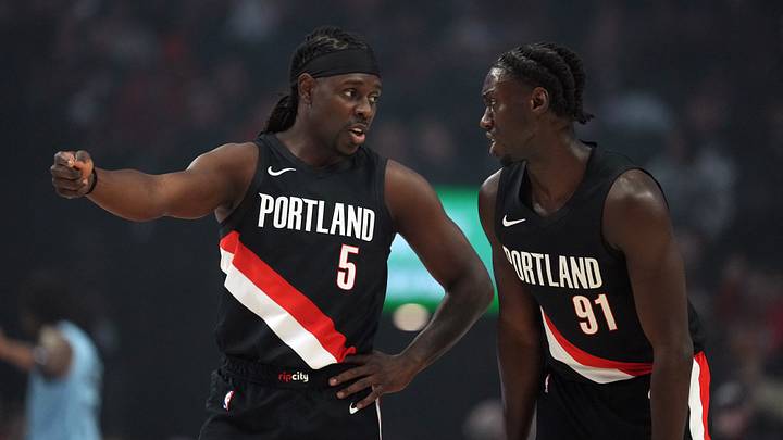 Feb 7, 2026; Portland, Oregon, USA; Portland Trail Blazers guard Jrue Holiday (5) talks with Sidy Cissoko (91) during the first half against the Memphis Grizzlies at Moda Center. Mandatory Credit: Soobum Im-Imagn Images