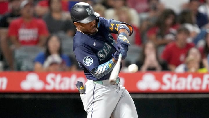 Seattle Mariners center fielder Julio Rodriguez hits a single against the Los Angeles Angels on Aug. 31 at Angel Stadium. Seattle Mariners center fielder Julio Rodriguez hits a single against the Los Angeles Angels on Aug. 31 at Angel Stadium.