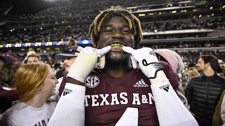 Nov 26, 2022; College Station, Texas, USA; Texas A&M Aggies defensive lineman Shemar Stewart (4) shows off his gold grill smile after the Aggies defeat the LSU Tigers at Kyle Field. Mandatory Credit: Jerome Miron-Imagn Images