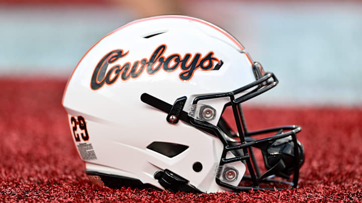 Nov 18, 2023; Houston, Texas, USA; A detailed view of an Oklahoma State Cowboys helmet on the sideline of the game against the Houston Cougars at TDECU Stadium. Mandatory Credit: Maria Lysaker-Imagn Images Nov 18, 2023; Houston, Texas, USA; A detailed view of an Oklahoma State Cowboys helmet on the sideline of the game against the Houston Cougars at TDECU Stadium. Mandatory Credit: Maria Lysaker-Imagn Images