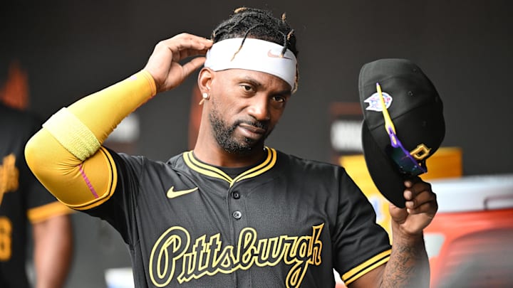 Andrew McCutchen (22) stands in the dugout before the game between the Baltimore Orioles and the Pittsburgh Pirates at Oriole Park at Camden Yards.