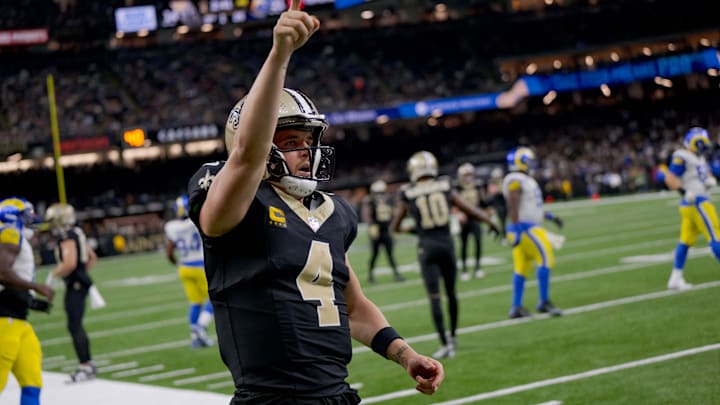 Dec 1, 2024; New Orleans, Louisiana, USA; New Orleans Saints quarterback Derek Carr (4) reacts after rushing for a first down against the Los Angeles Rams during the fourth quarter at Caesars Superdome. Mandatory Credit: Matthew Hinton-Imagn Images