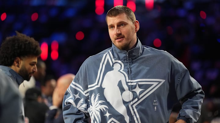 Feb 15, 2026; Inglewood, California, USA; Team World center Nikola Jokic (15) of the Denver Nuggets looks on before game 1 during the 75th NBA All Star Game at Intuit Dome. Mandatory Credit: Kirby Lee-Imagn Images Feb 15, 2026; Inglewood, California, USA; Team World center Nikola Jokic (15) of the Denver Nuggets looks on before game 1 during the 75th NBA All Star Game at Intuit Dome. Mandatory Credit: Kirby Lee-Imagn Images