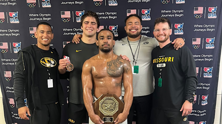 Redshirt junior Josh Edmond stands with teammates and coaches after becoming a U23 National Champion at 70kg, on Sunday, June 1, 2-25. 