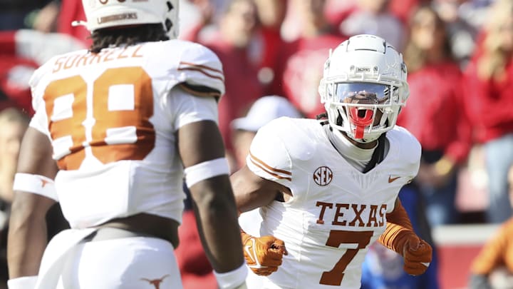 Nov 16, 2024; Fayetteville, Arkansas, USA; Texas Longhorns defensive back Jahdae Barron (7) celebrates after making a play against the Arkansas Razorbacks during the first quarter at Donald W. Reynolds Razorback Stadium. Mandatory Credit: Nelson Chenault-Imagn Images