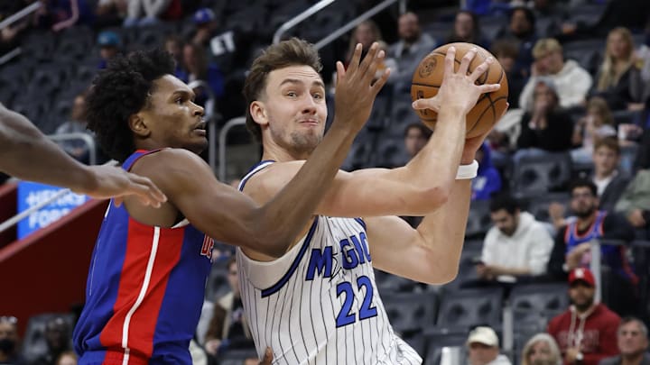 Oct 29, 2025; Detroit, Michigan, USA; Orlando Magic forward Franz Wagner (22) is defended by Detroit Pistons guard Ausar Thompson (9) in the first half at Little Caesars Arena. Mandatory Credit: Rick Osentoski-Imagn Images